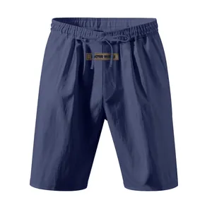 High-quality front view of navy blue linen shorts featuring drawstring and waist label