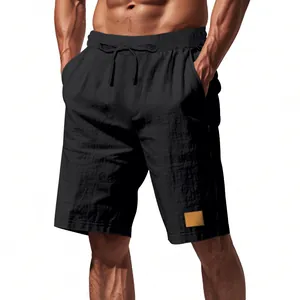 Vista dettagliata dei pantaloncini casual in lino nero da uomo con coulisse e logo