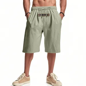 Comfortable men's loose breathable linen shorts in sage green with a drawstring waist