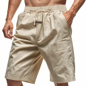 Close-up of beige linen casual shorts featuring drawstring waist and fabric texture