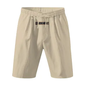 Detail view of khaki linen shorts with elastic waist and drawstring design