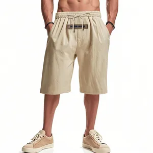 Detail view showing the breathable beige linen fabric of these men's loose casual shorts