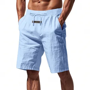 Close-up detail of men's light blue breathable linen shorts with drawstring waist.