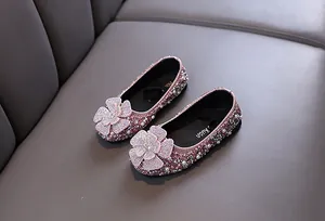 Detailed view of pink toddler girl princess flats featuring sparkling rhinestones and pearl details