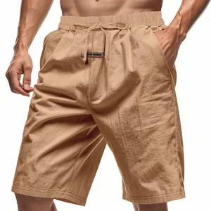 Close-up of men's beige linen casual shorts featuring drawstring waist and side pockets
