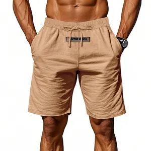 Detailed view of men's breathable khaki linen summer shorts with drawstring waist.