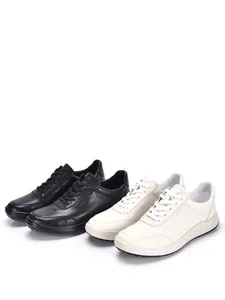 Zapatillas casuales de cuero premium en blanco y negro con suela blanda