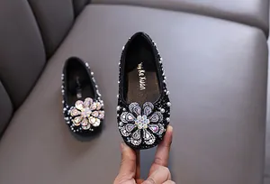 Sparkly black girls princess shoes with large rhinestone flower detail for dance