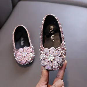 Sparkly rhinestone princess dress shoes for girls featuring a large crystal flower detail