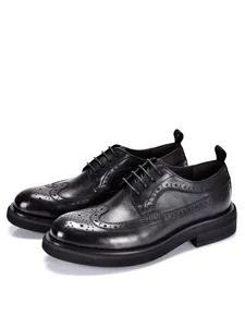 Premium men's black leather brogue shoes featuring detailed wingtip carving and thick soles.