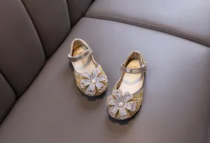 Sparkling gold girls princess shoes with large rhinestone flower for performance