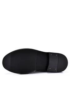 Anti-slip black rubber sole detail of a classic men's Brogue business leather shoe