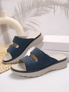 Elegant blue women's thick-sole slide sandals with woven texture and metal studs