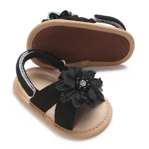 Infant girl summer sandals with black floral detail and non-slip soft rubber sole