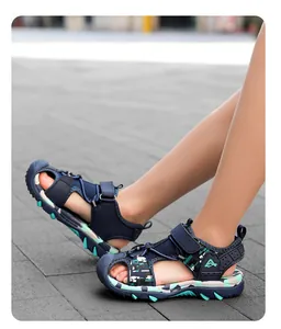 Detailed side view of boys' closed-toe sport sandals with a non-slip soft sole for summer