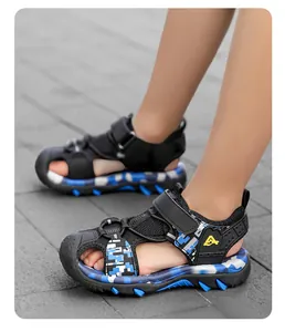 Detailed view of boys blue camouflage closed-toe sports sandals for outdoor beach