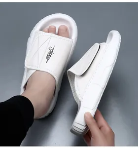 White leather men's slipper with thick EVA sole shown from the side and on foot