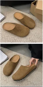 Detailed view of brown suede closed-toe mules with platform rubber soles for women