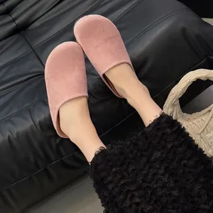 Pink suede closed-toe mules for women in a chic Korean style, shown on feet.