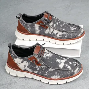 Casual hereninstappers met camouflageprint, dikke rubberen zool en bruine lederen details