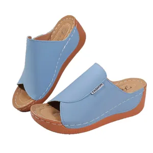 Elegant light blue wedge sandals for women with a comfortable cushioned brown sole