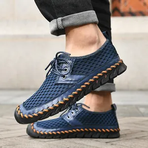 Close-up detail of men's breathable mesh outdoor water shoes featuring orange hand-stitching.