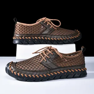Detailed view of brown mesh breathable hiking shoes with unique hand-stitched detailing