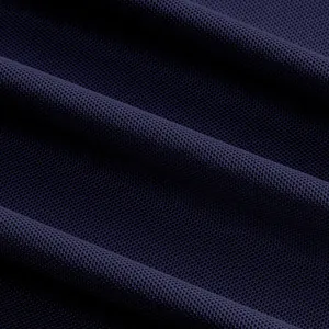 Close-up view of breathable navy blue mesh fabric for quick-dry polo shirts
