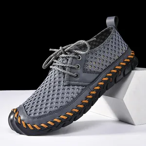 Men's breathable mesh wading shoes with hand-stitched non-slip sole for outdoor hiking.