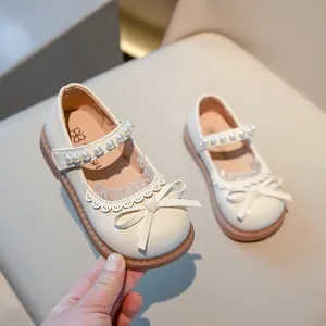 Elegante crèmewitte prinsessenschoenen voor meisjes met strik en parelband