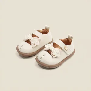 Elegant beige baby walker shoes featuring delicate white bow accents for girls