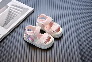 Cute pink LED light-up sandals for toddlers featuring a friendly cartoon bear design