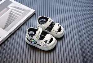 Close-up detail of white toddler light-up sandals with cartoon panda and LED lights