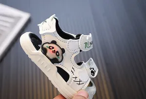 Detailed side view of white toddler light-up sandals with a glowing cartoon panda feature