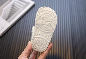 Macro view of the white anti-slip outsole detail on infant soft sole walking sandals