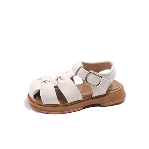 Toddler girl's closed-toe sandals with soft sole and buckle for summer beach wear.