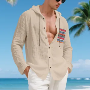 Men's bohemian linen hooded long sleeve shirt with colorful pocket detail at beach