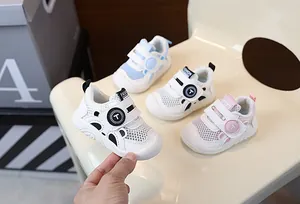 Detailed view of breathable mesh toddler walking shoes in four colors on a chair.