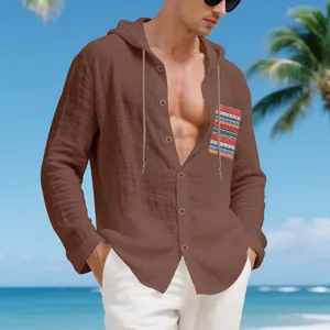 Detail of men's brown linen hooded shirt with vibrant Bohemian ethnic pattern pocket