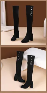 Detailed view of elegant black over-the-knee boots with block heels and buckle accents.