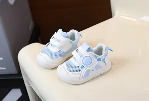 Close-up of breathable light blue and white mesh infant walking shoes with soft soles