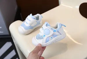 Detailed view of breathable light blue mesh baby walking shoes with soft non-slip soles