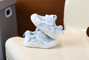 Detailed view of breathable mesh toddler walking shoes with a secure velcro strap closure