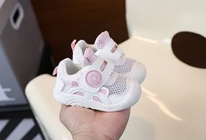 Close-up of pink breathable mesh toddler walking shoes with soft non-slip rubber soles
