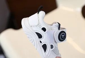 Close-up of white breathable mesh infant walking shoes with panda design