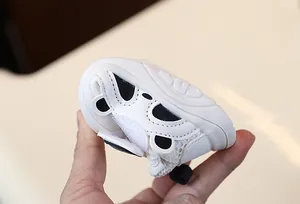 Close-up of breathable white baby walking shoes with a soft non-slip sole design