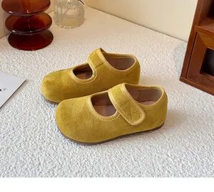 Vibrant yellow suede Mary Jane shoes for girls with comfortable hook and loop strap