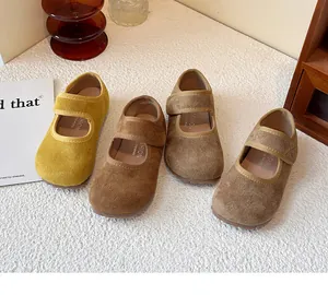 Collection of colorful suede children's Mary Jane shoes in warm earthy tones and textures