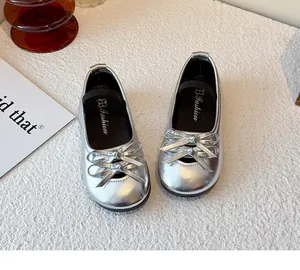 Shiny silver girls' Mary Jane flats featuring elegant double bow detail and soft flexible sole