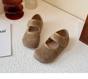 Close-up detail of brown suede Mary Jane shoes for kids featuring a convenient velcro strap